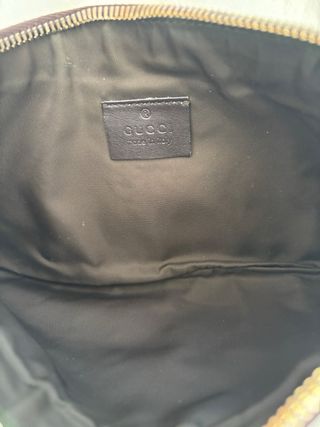 Pochette Gucci in pelle marrone