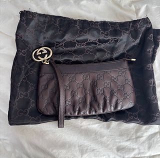 Pochette Gucci in pelle marrone