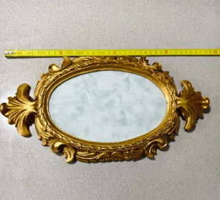 Espejo ovalado de resina con pan de oro
