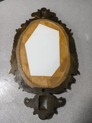 Espejo ovalado de resina con pan de oro