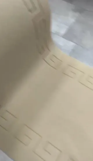 Tappeto a metro con bordo decorativo