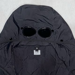 Giacca CP Company Nera con Cappuccio e Lenti