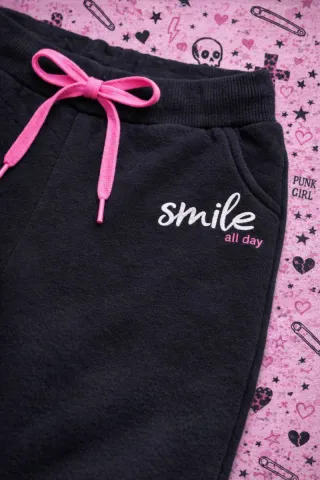 Pantaloni neri con laccetti rosa smile