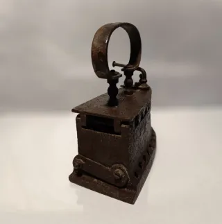 Plancha antigua de carbón