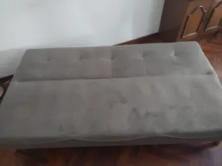 Sofá cama gris de tela