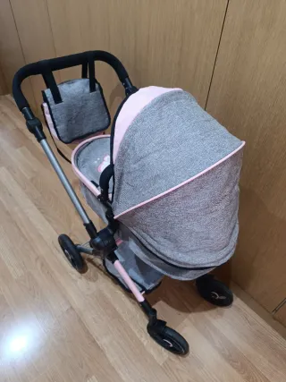Carrito de bebé gris y rosa