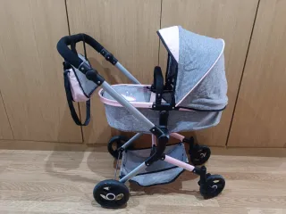 Carrito de bebé gris y rosa