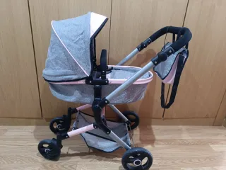 Carrito de bebé gris y rosa