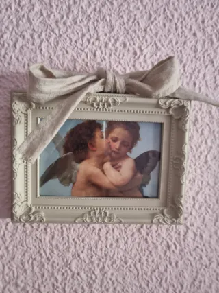 Dos marcos con la lámina de angelitos