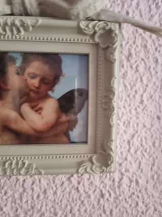 Dos marcos con la lámina de angelitos