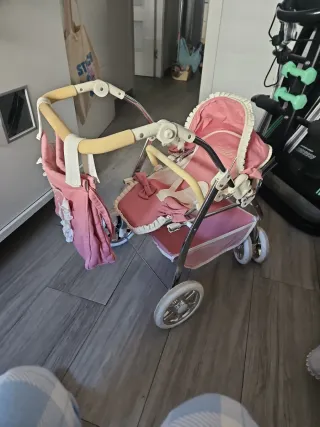 Carrito de muñecas rosa
