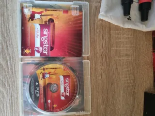 Singstar PS3: 2 Juegos + Micrófonos Inalámbricos
