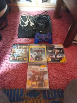 PS3 Slim Negra + 4 Juegos un mando cable de HDMI