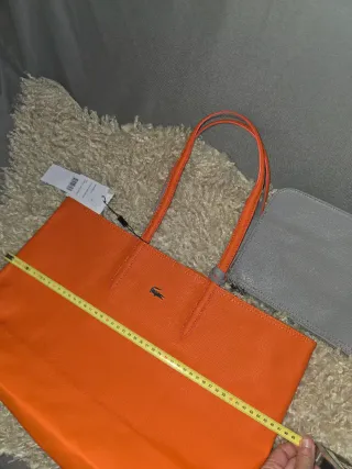 Bolso Lacoste reversible naranja e gris + neceser