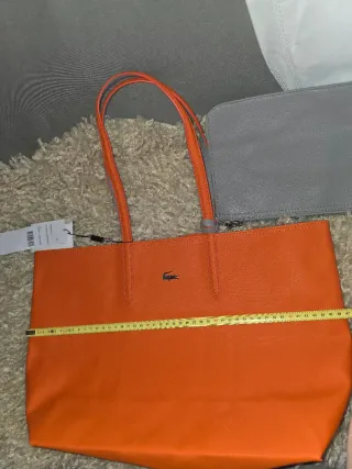 Bolso Lacoste reversible naranja e gris + neceser