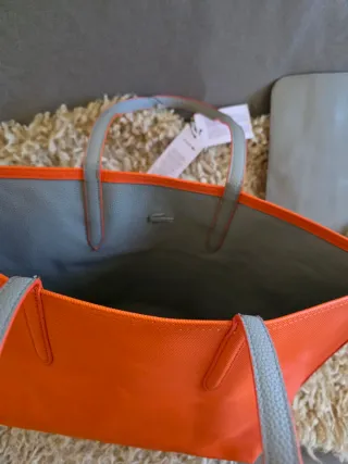 Bolso Lacoste reversible naranja e gris + neceser