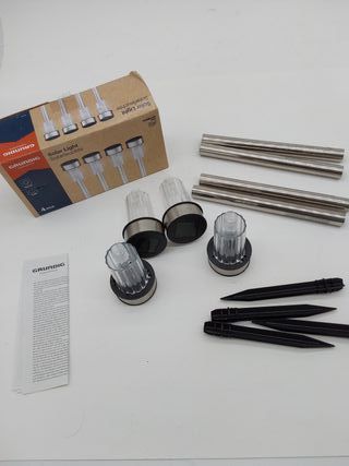 GRUNDIG - Lámpara solar exterior con luz solar de 4 piezas – Lámparas de jardín sobre estaca – Luz blanca – Resistente al agua I