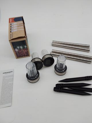 GRUNDIG - Lámpara solar exterior con luz solar de 4 piezas – Lámparas de jardín sobre estaca – Luz blanca – Resistente al agua I