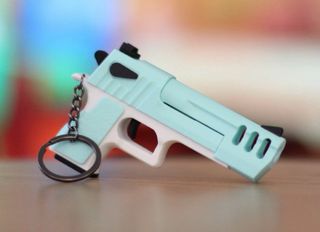 Portachiavi pistola assortiti. Scarrellanti