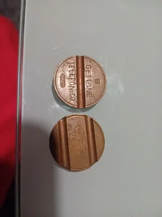 Monedas telefónicas antiguas