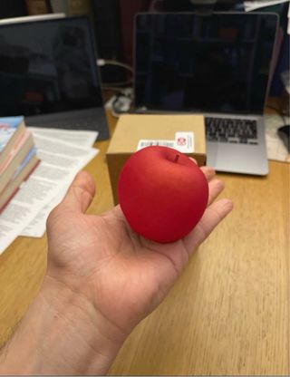 Candela a forma di mela rossa