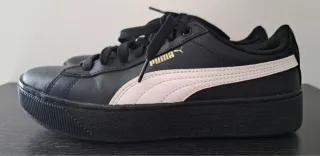 Scarpe Puma nere con dettagli oro