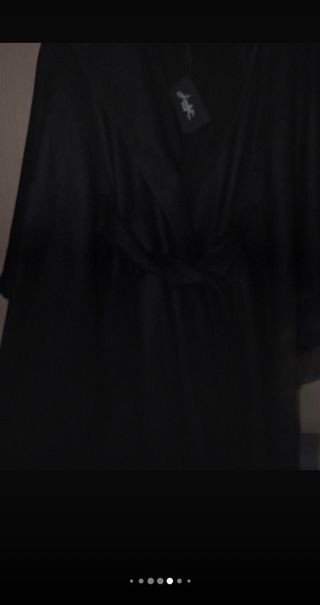 Capotto poncho nero con frange