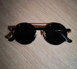 Occhiali da sole uomo rotondi neri e oro