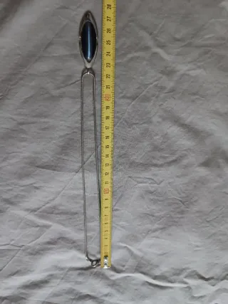 Colgante y pendientes ojo de gato de acero.