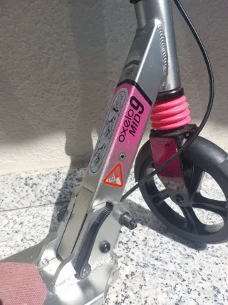 Patinete Oxelo MID 9 rosa usado en dos ocasiones..