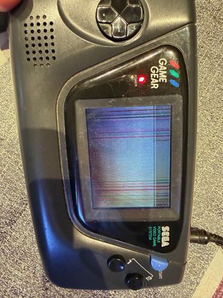 Sega Game Gear con juego x-men y adaptador