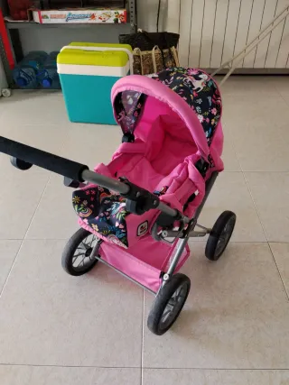 Cochecito de bebé rosa con unicornios