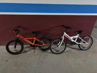 Bicicletas ..la blanca 18” y la naranja 16”