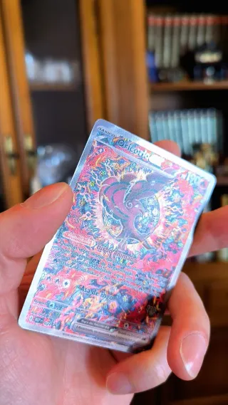 HERMOSO CHARIZARD Y ORICORIO