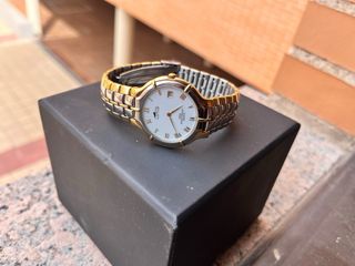 Reloj Lotus Oro y Plata