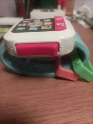 Fisher-Price Reloj bebé en Portugués