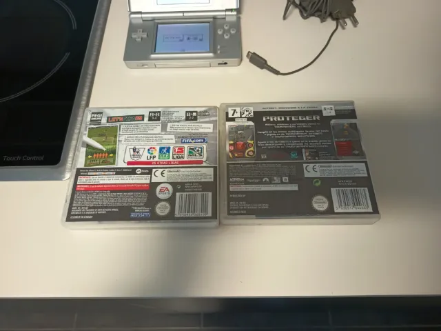 Nintendo DS Lite y juegos FIFA 09 y Transformers