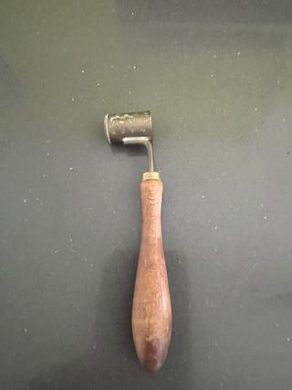 Antiguo medidor de pólvora