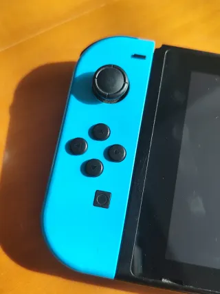 Nintendo Switch V2 Azul/Rojo + Super Smash Bros
