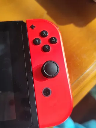 Nintendo Switch V2 Azul/Rojo + Super Smash Bros