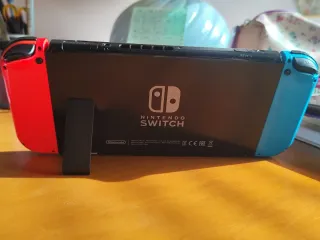 Nintendo Switch V2 Azul/Rojo + Super Smash Bros