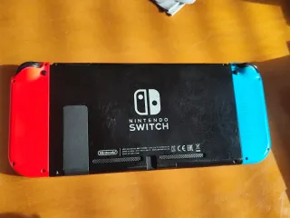 Nintendo Switch V2 Azul/Rojo + Super Smash Bros