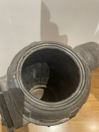 Antigua estufa serrín hierro