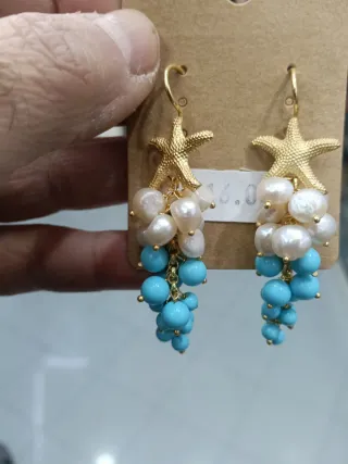 Orecchini pendenti con stelle marine e perle