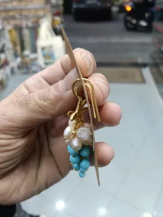 Orecchini pendenti con stelle marine e perle