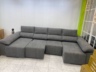 Sofá U gris con cama y arcones