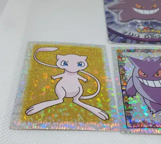 Cromos Pokémon Gengar, Mew y Snorlax