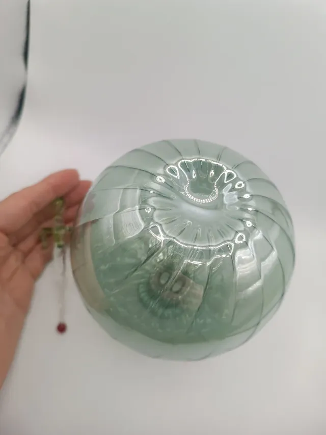 Bottiglietta tonda in vetro verde