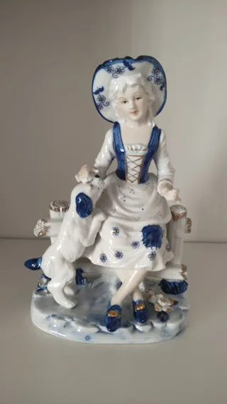 Pareja figuras porcelana con perros