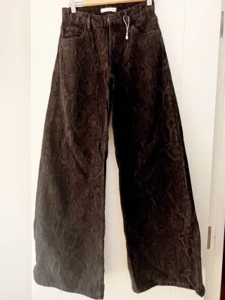 Vaqueros anchos negros animal print Talla S